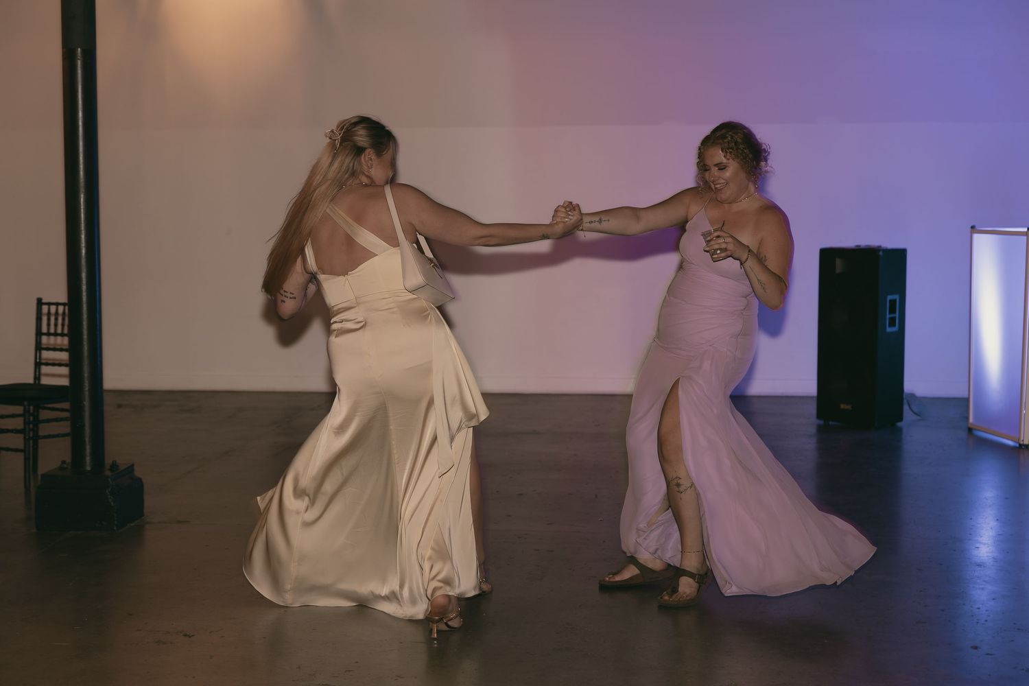 Wedding guests dancing at reception in Cleveland Ohio by Gypsy Lens Photography. Moody, vintage, documentary wedding photographer.