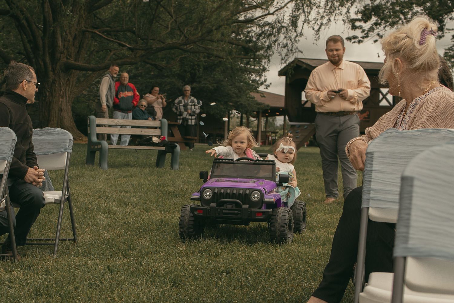 Flower girls coming down the aisle in Ashtabula Ohio by Gypsy Lens Photography. Moody, vintage, nostalgic documentary wedding photography.