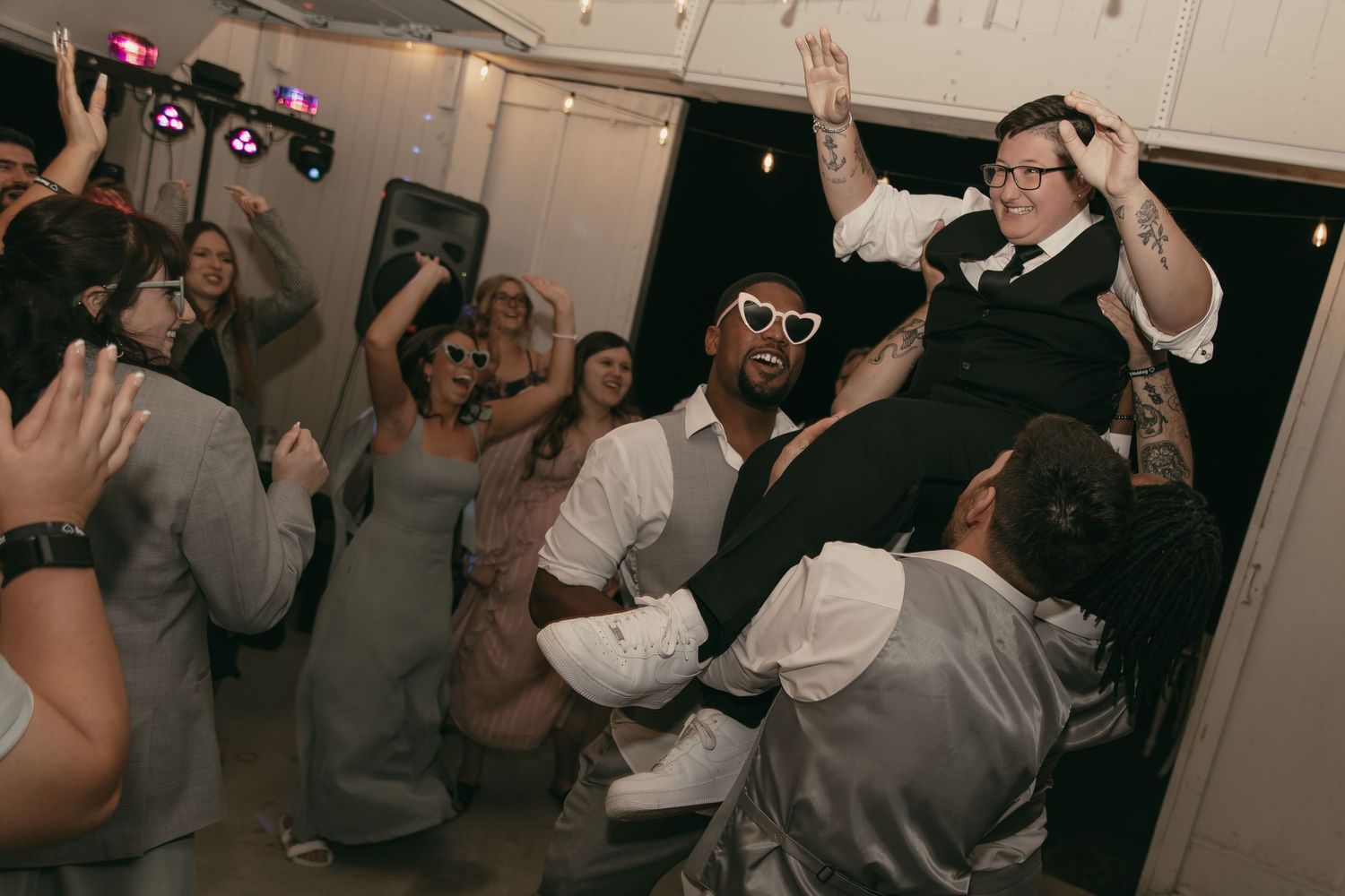 Energetic reception with bride and groomsmen in Cleveland Ohio by Gypsy Lens Photography. Moody, vintage, documentary wedding photography.