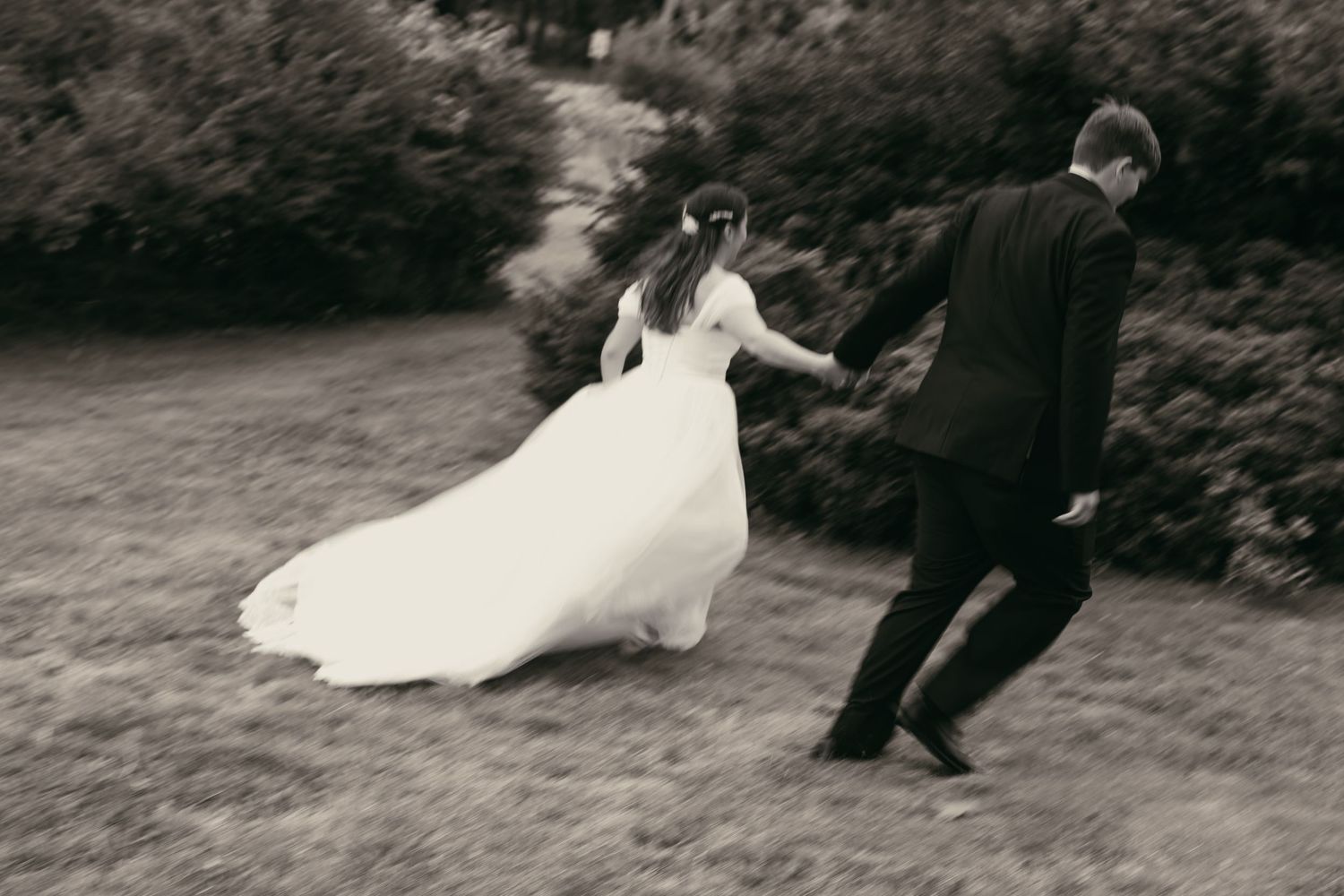 Motion blur artistic vintage couple running in Ashtabula Ohio by Gypsy Lens Photography. Moody, vintage, documentary wedding photography.