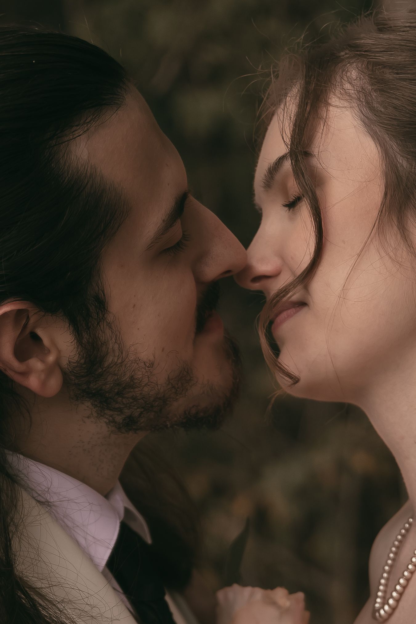 Intimate romantic moment of couple in Hermitage Pennsylvania by Gypsy Lens Photography. Moody, vintage, documentary wedding photo.