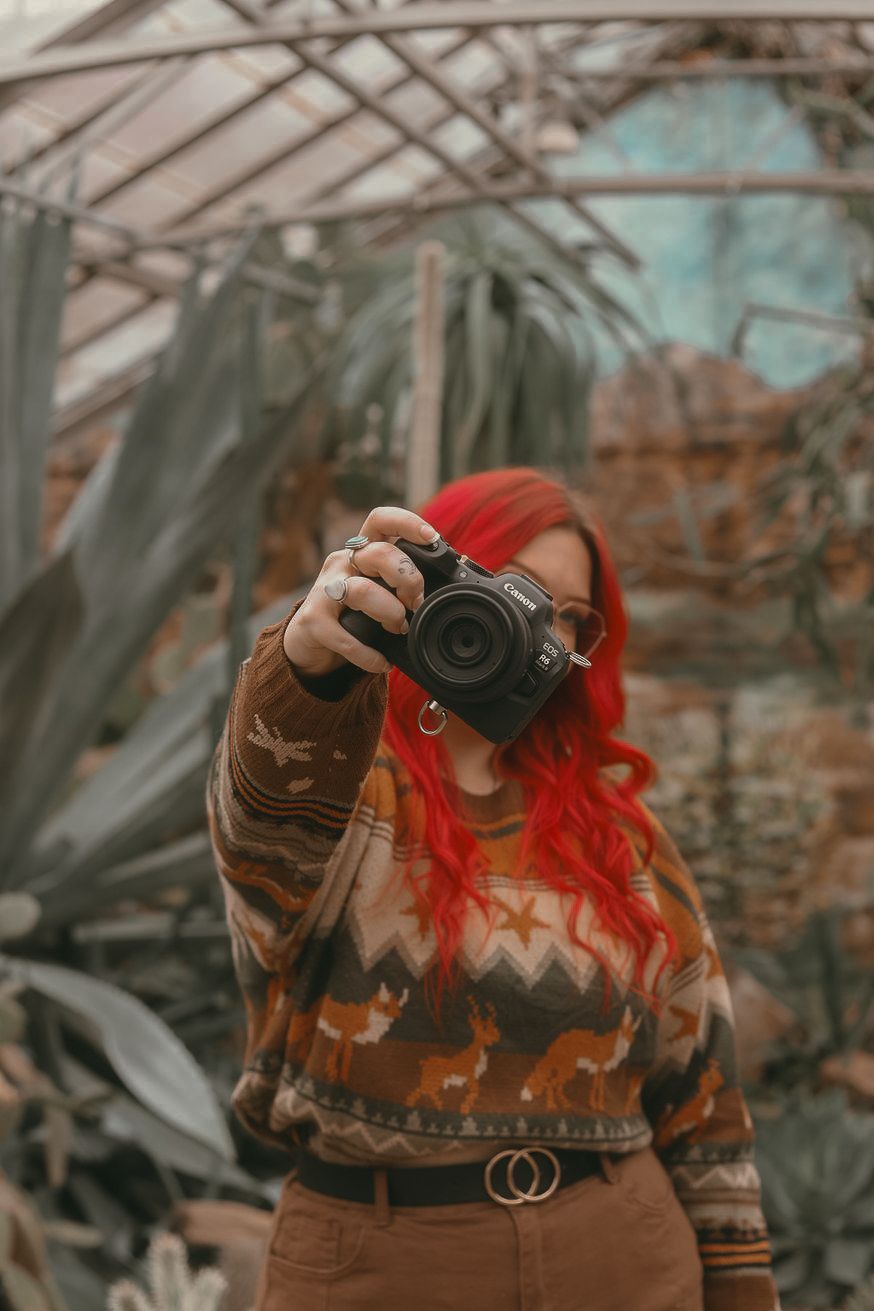 Photographer holding camera in Cleveland Ohio by Gypsy Lens Photography, a moody documentary wedding photographer, nostalgic