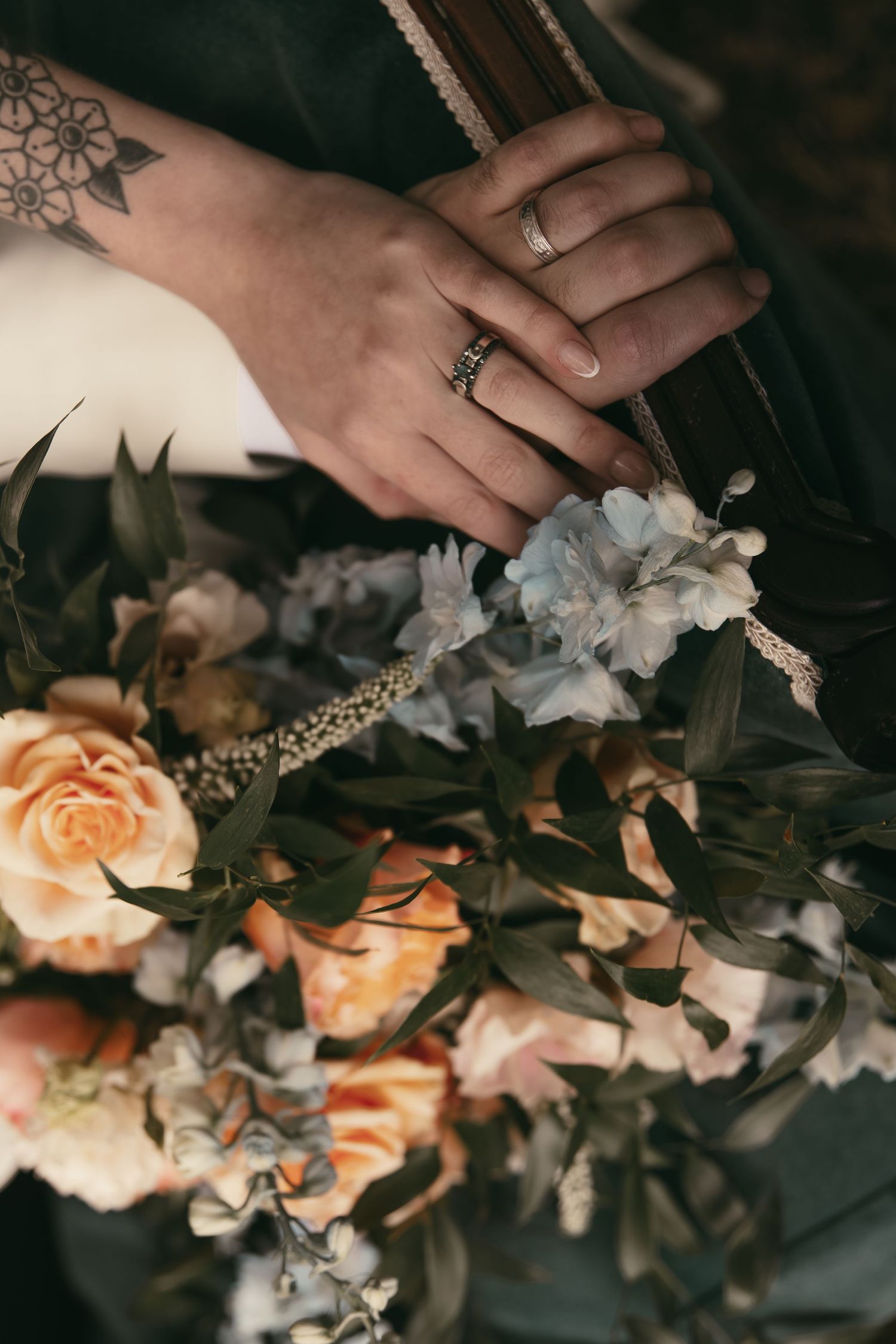 Intimate romantic moment of couple hands in Hermitage Pennsylvania by Gypsy Lens Photography. Moody, vintage, documentary wedding photo.