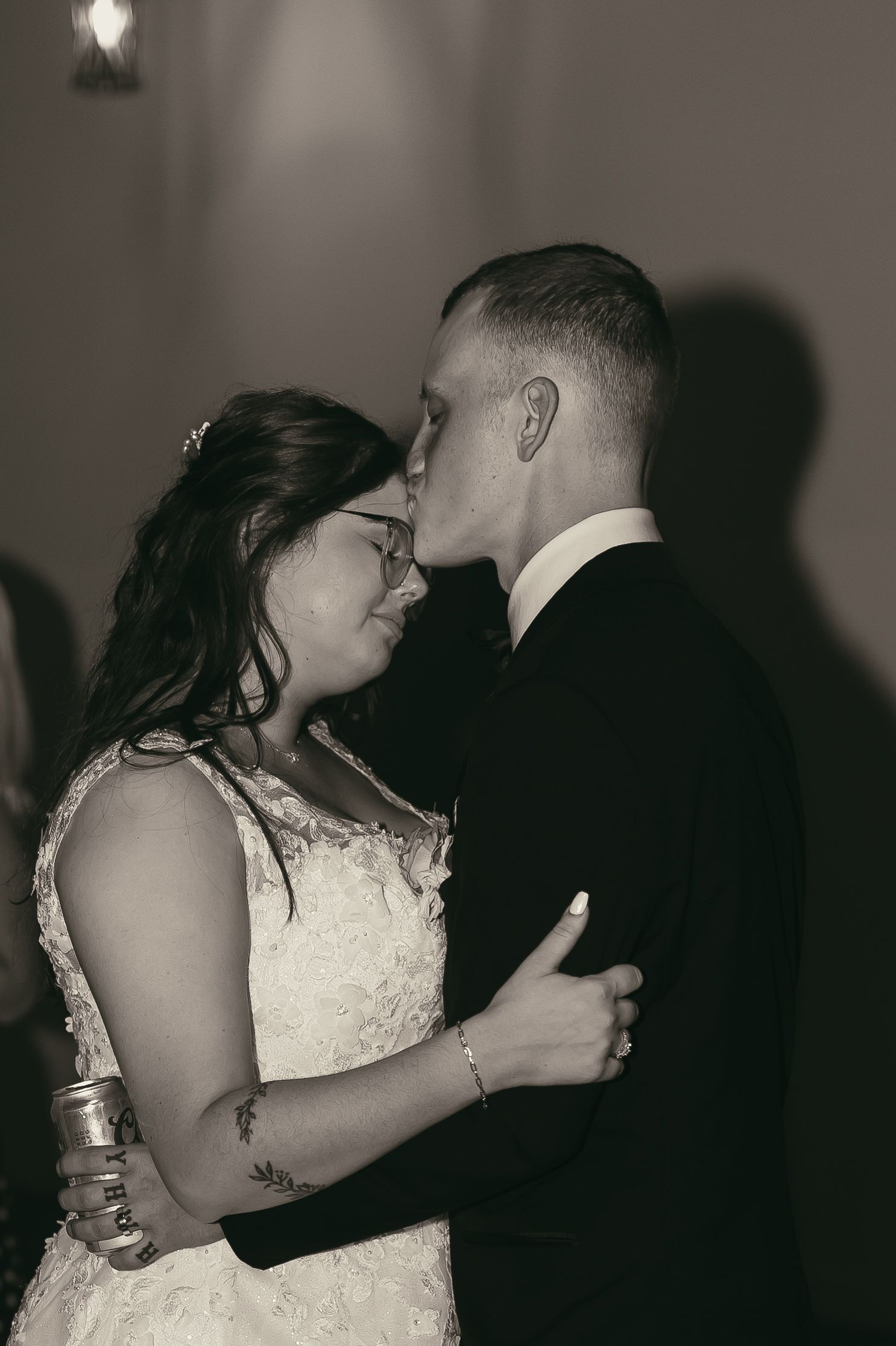 Bride and groom kissing during dance in Cleveland Ohio by Gypsy Lens Photography. Moody, filmy, vintage, documentary wedding photography.