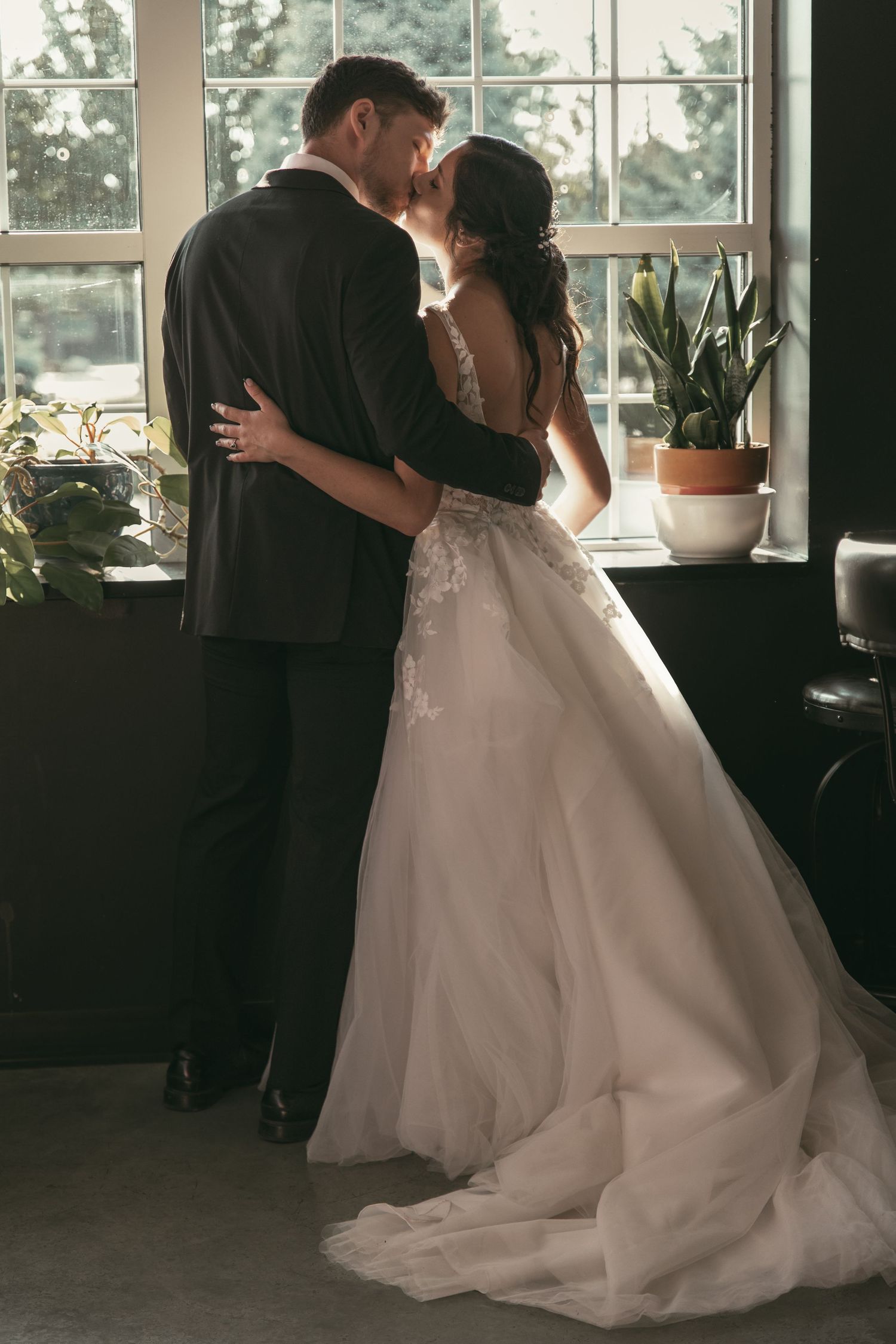 Newlyweds in coffeeshop in Tallmadge Ohio by Gypsy Lens Photography. Moody, vintage, documentary wedding photography.