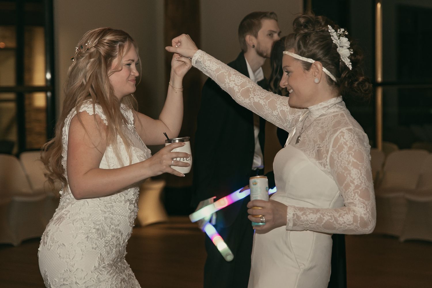 Two brides dancing at wedding reception in Lake County Ohio by Gypsy Lens Photography. Moody, vintage, documentary wedding photography.