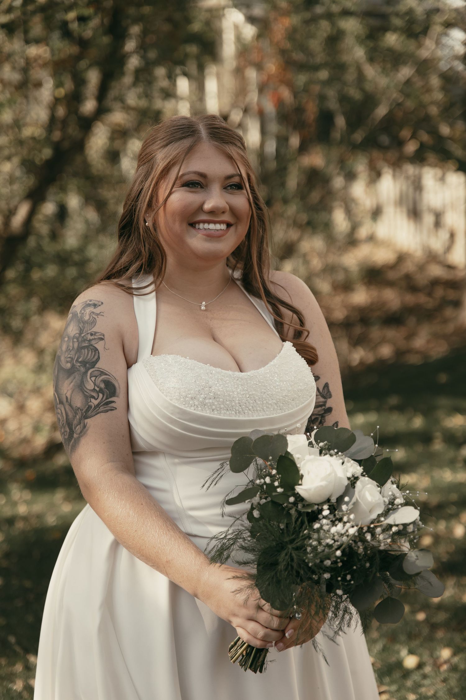 Radiant bride with her bouquet on wedding day in Cleveland Ohio by Gypsy Lens Photography. Moody, vintage, documentary wedding photography.