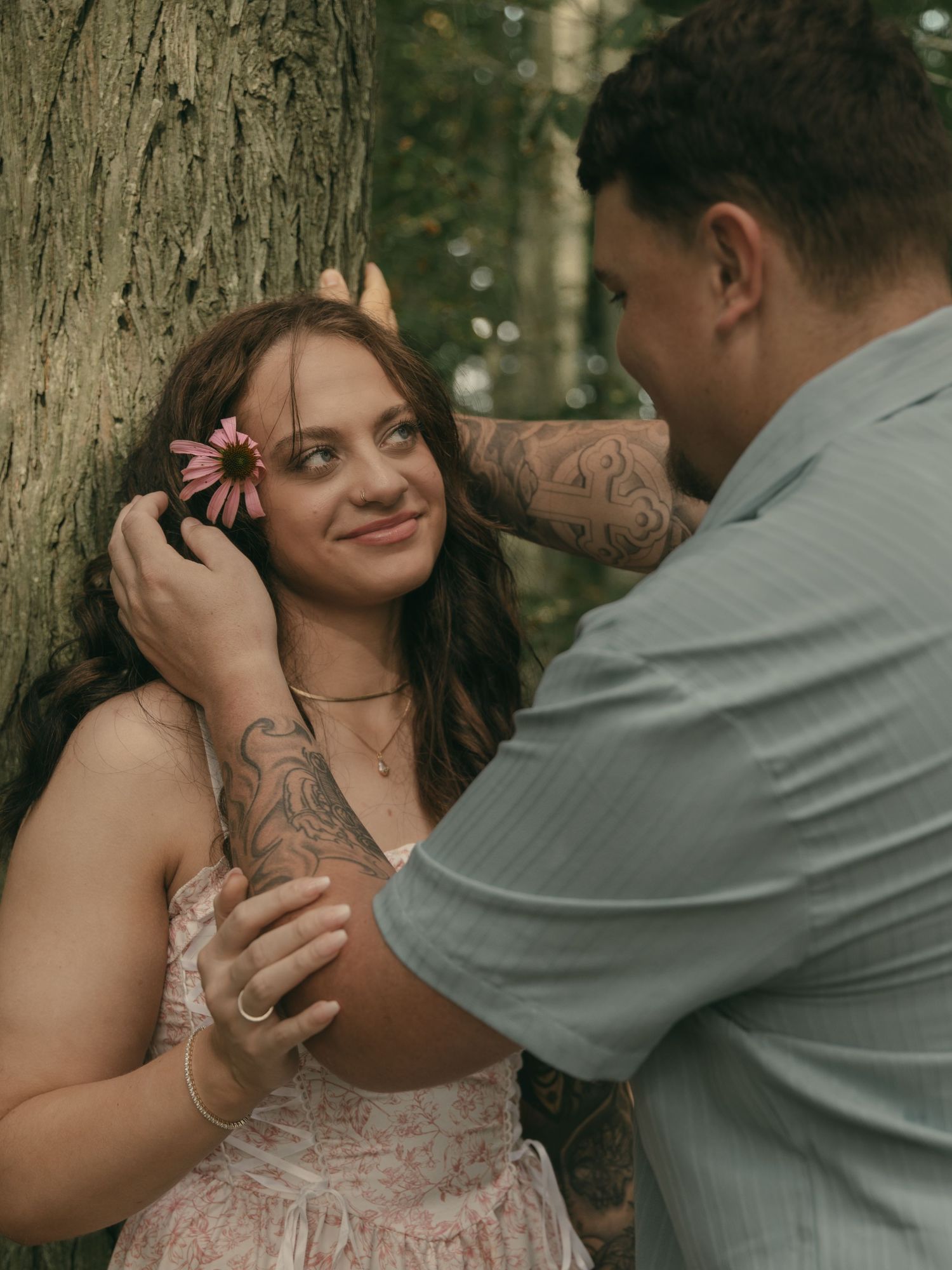 Engaged couple being intimate in Lake County Ohio by Gypsy Lens Photography. Moody, filmy, vintage, documentary wedding photography
