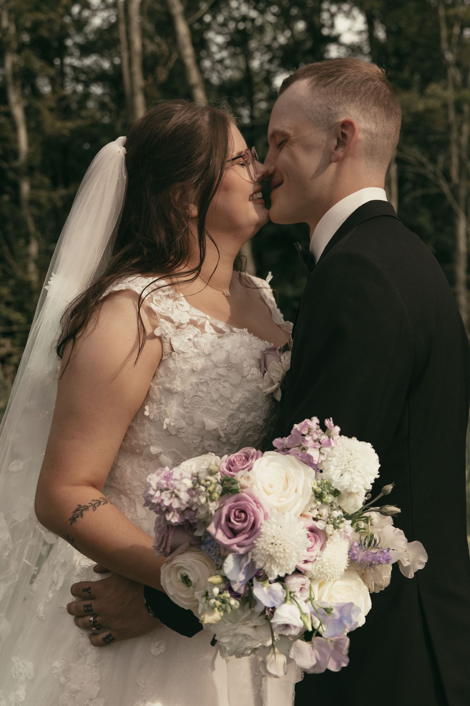 Bridal portraits of couple kissing in Cleveland Ohio by Gypsy Lens Photography. Moody, vintage, documentary wedding photographer.