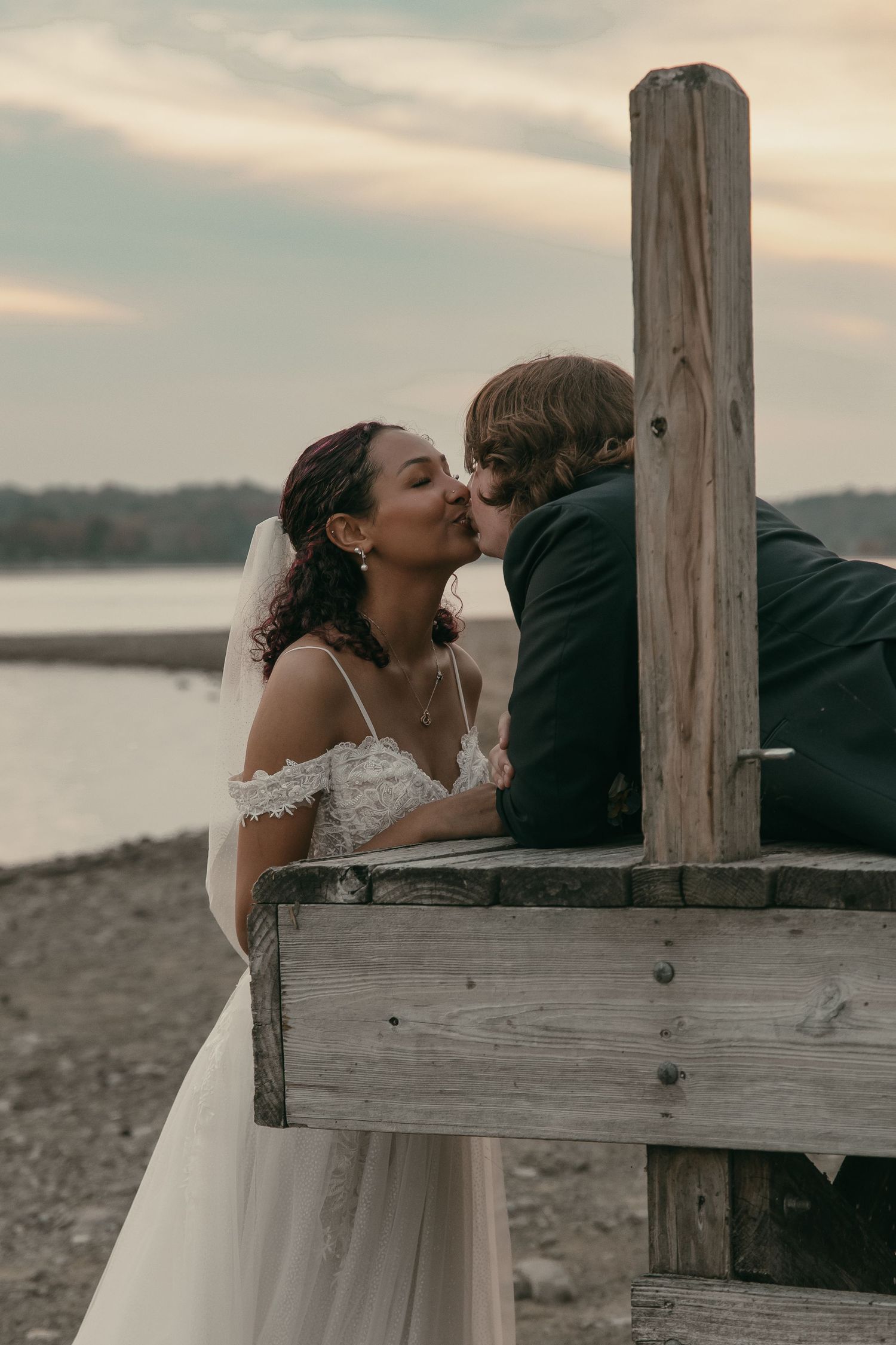Bridal portraits on beach in Cleveland Ohio by Gypsy Lens Photography. Moody, vintage, documentary wedding photography.