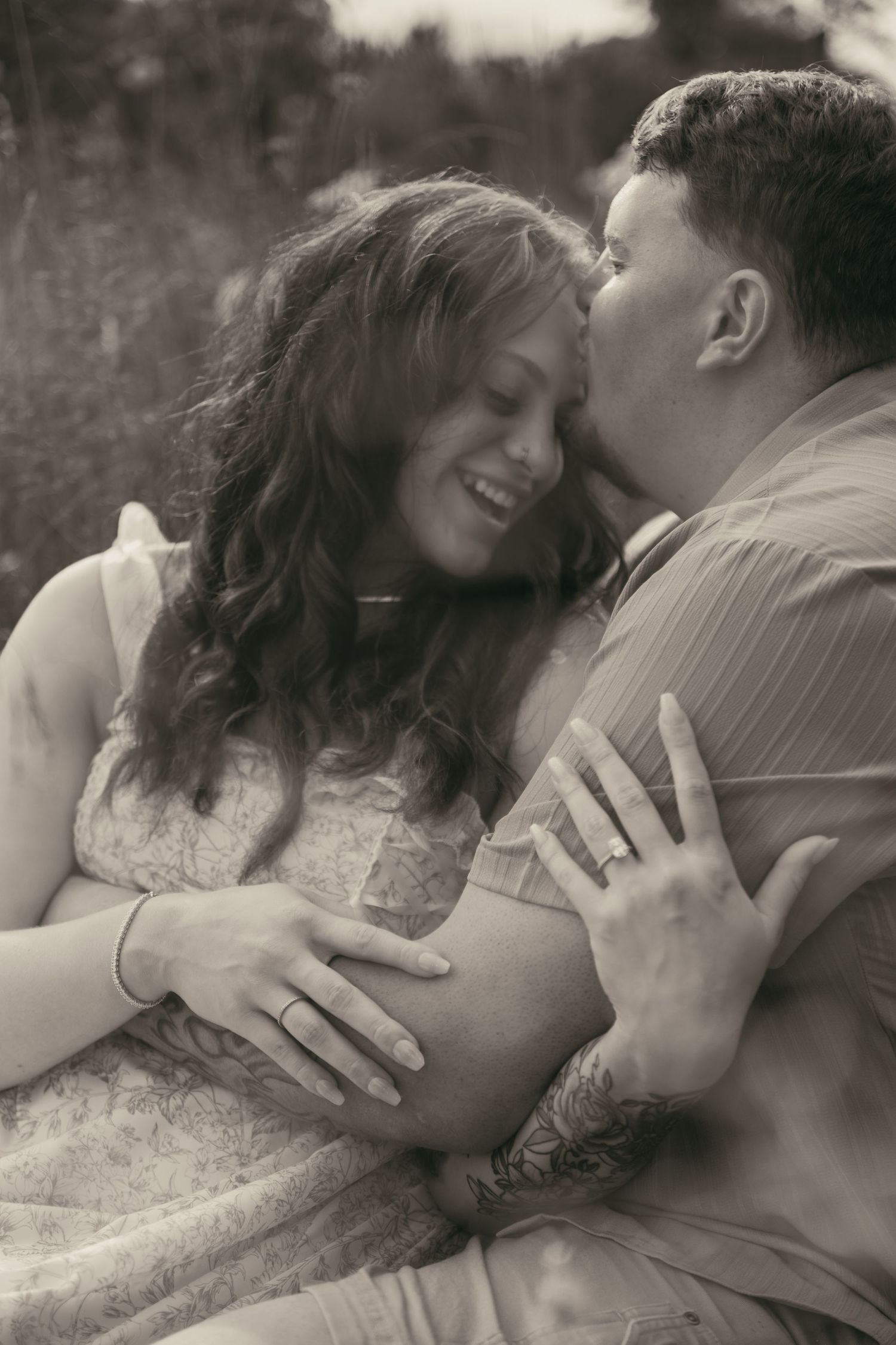 Couple kissing in a wildflower meadow in Lake County Ohio by Gypsy Lens Photography. Moody, filmy, vintage, documentary wedding photography