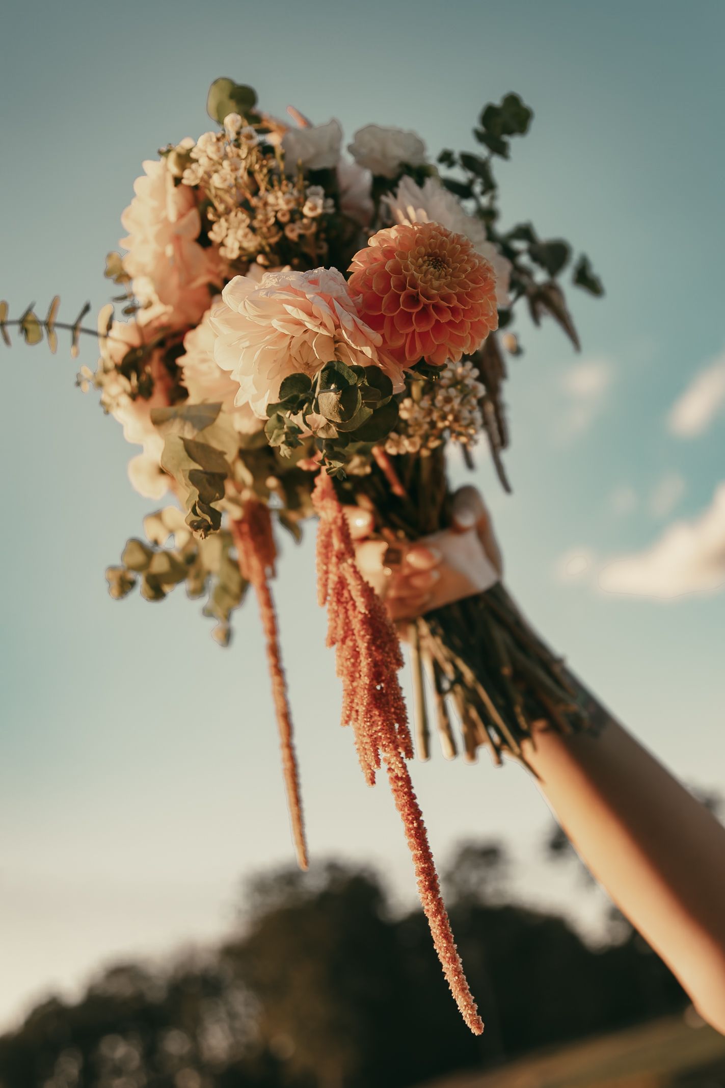 Warm wedding bouquet with vintage watch in Akron Ohio by Gypsy Lens Photography. Moody, filmy, vintage, documentary wedding photography.