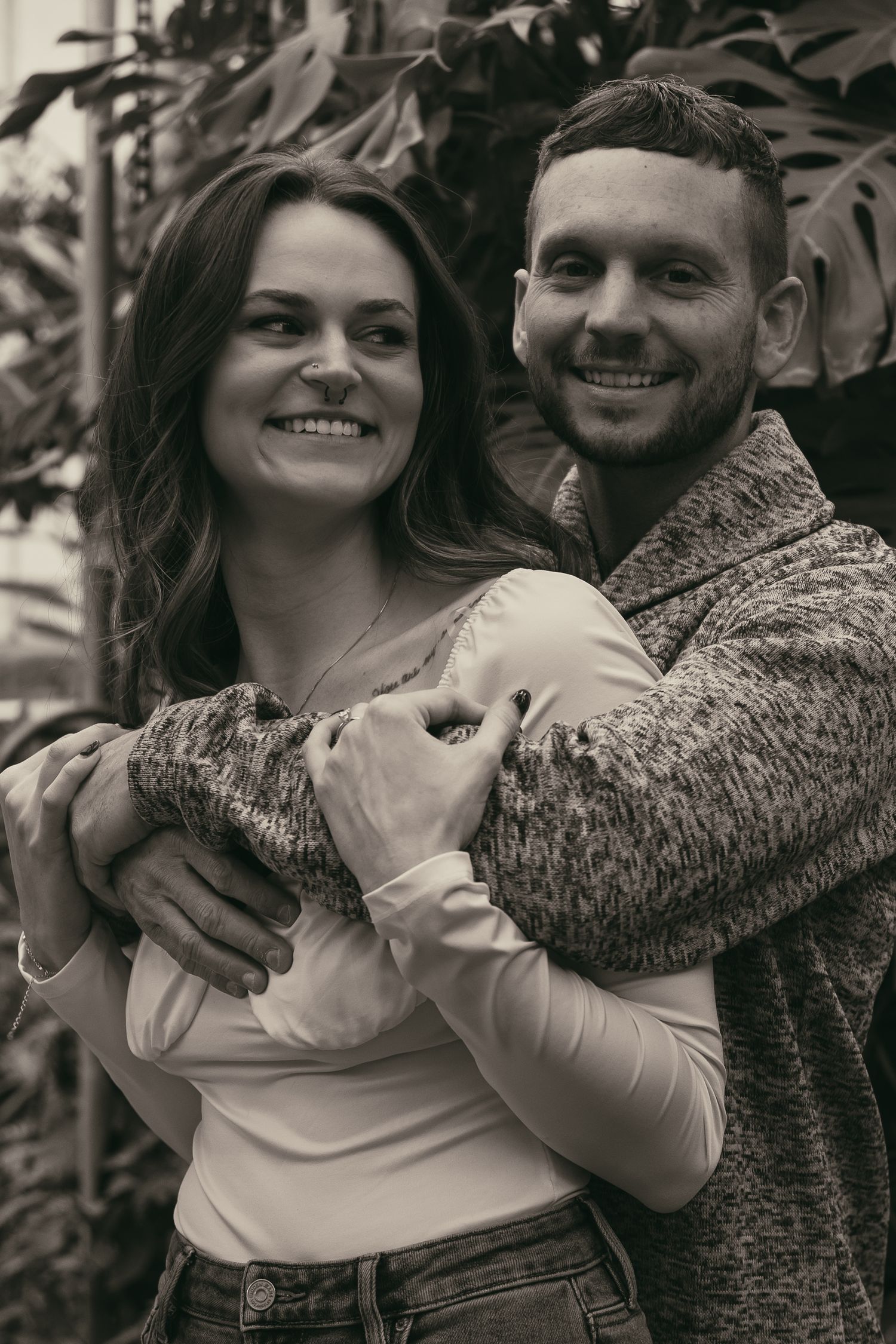 Candid couple moment at greenhouse in Cleveland Ohio by Gypsy Lens Photography. Moody, filmy, vintage, documentary wedding photography
