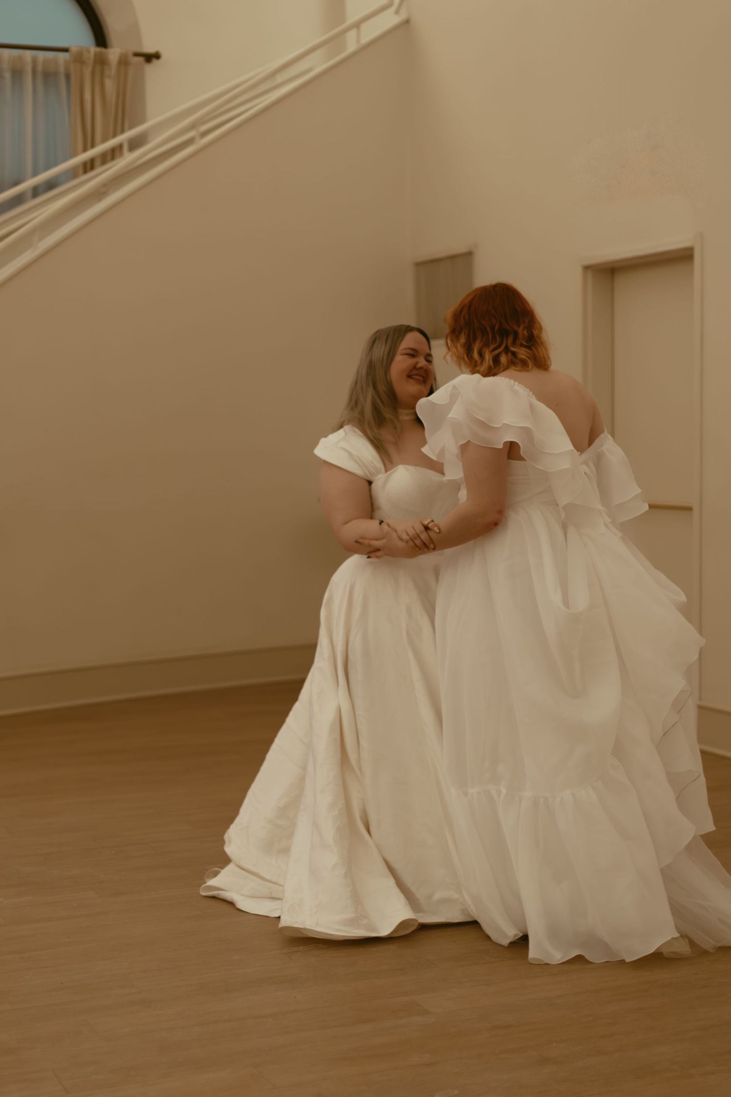 Two brides share their first dance in Cleveland Ohio by Gypsy Lens Photography. Moody, filmy, vintage, documentary wedding photography.