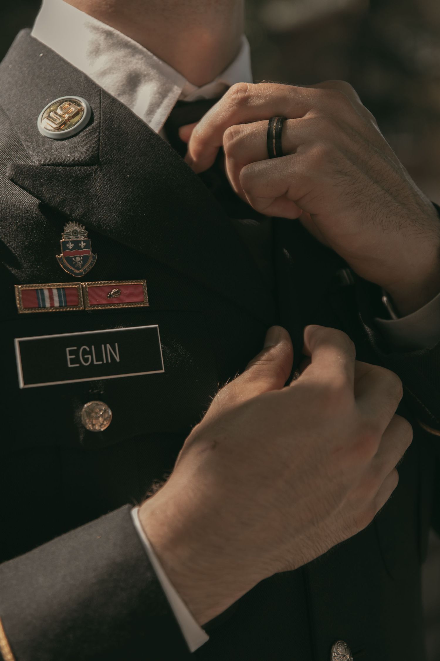 Close-up details of military uniform for groom in Cleveland Ohio by Gypsy Lens Photography. Moody, vintage, nostalgic documentary wedding.