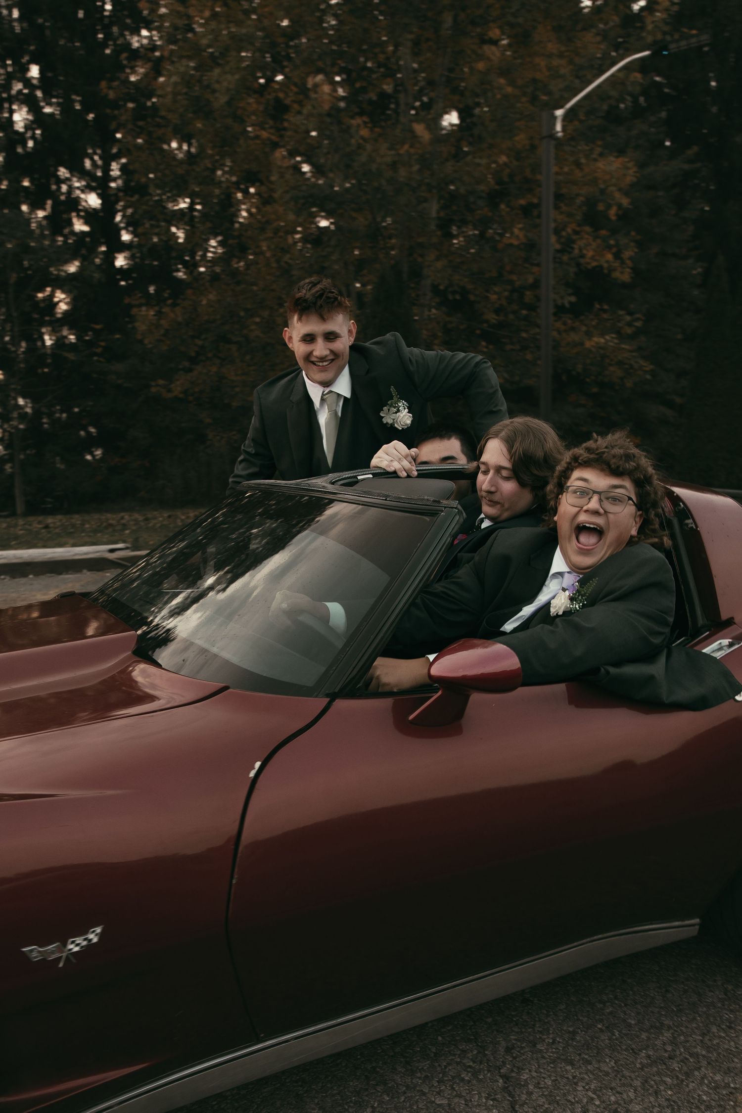 Groomsmen photos in vintage car in Cleveland Ohio by Gypsy Lens Photography. Moody, vintage, documentary wedding photography.