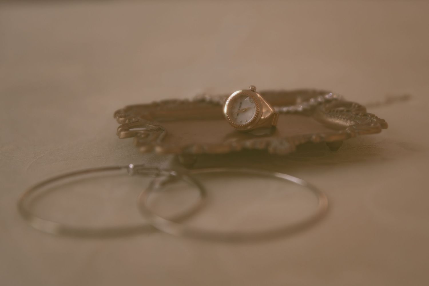 Vintage grainy detail of jewelry in Cleveland Ohio by Gypsy Lens Photography. Moody, filmy, vintage, documentary wedding photography.