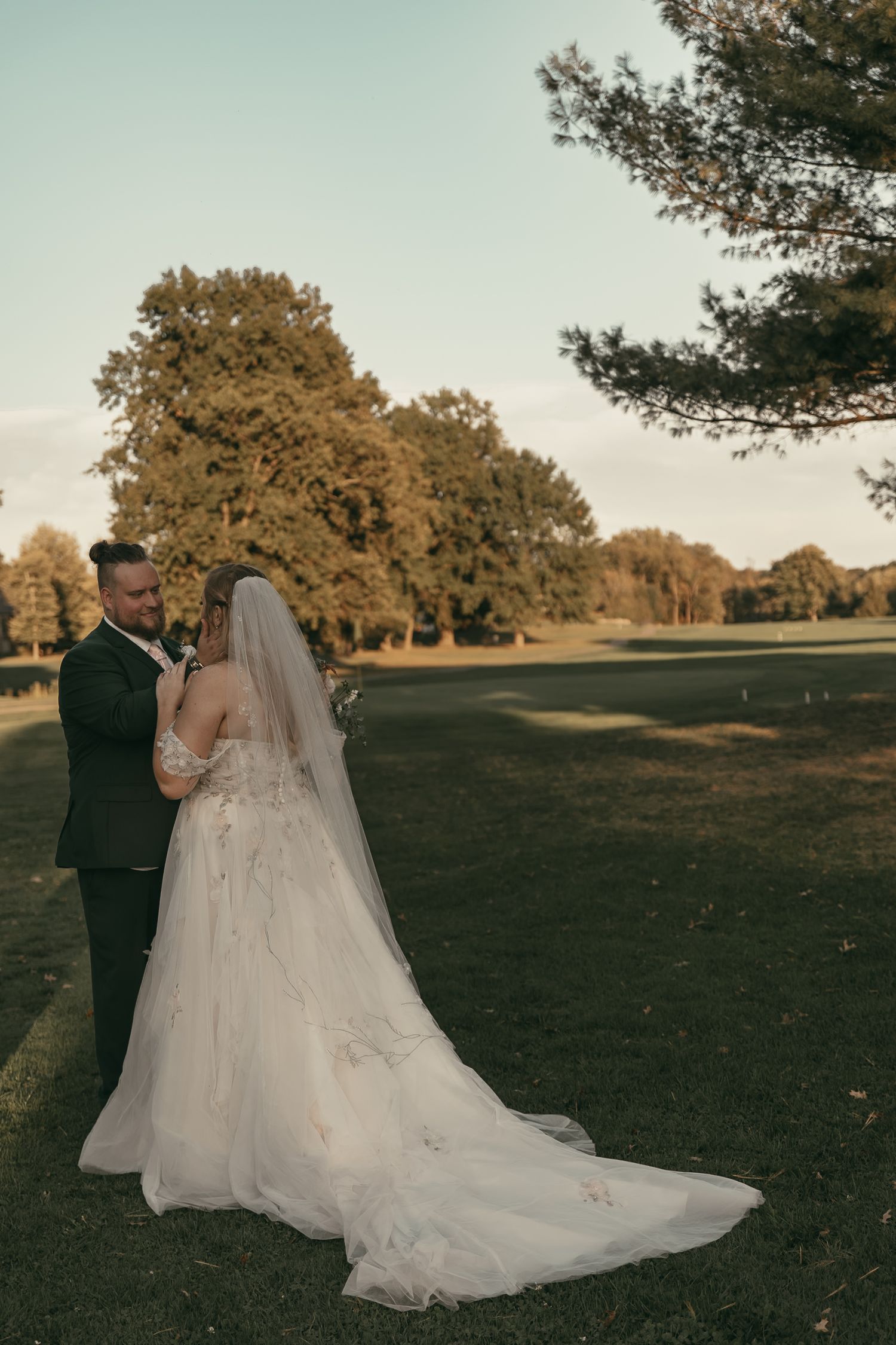 Bride and groom at golf course in Akron Ohio by Gypsy Lens Photography. Moody, filmy, vintage, documentary wedding photography.