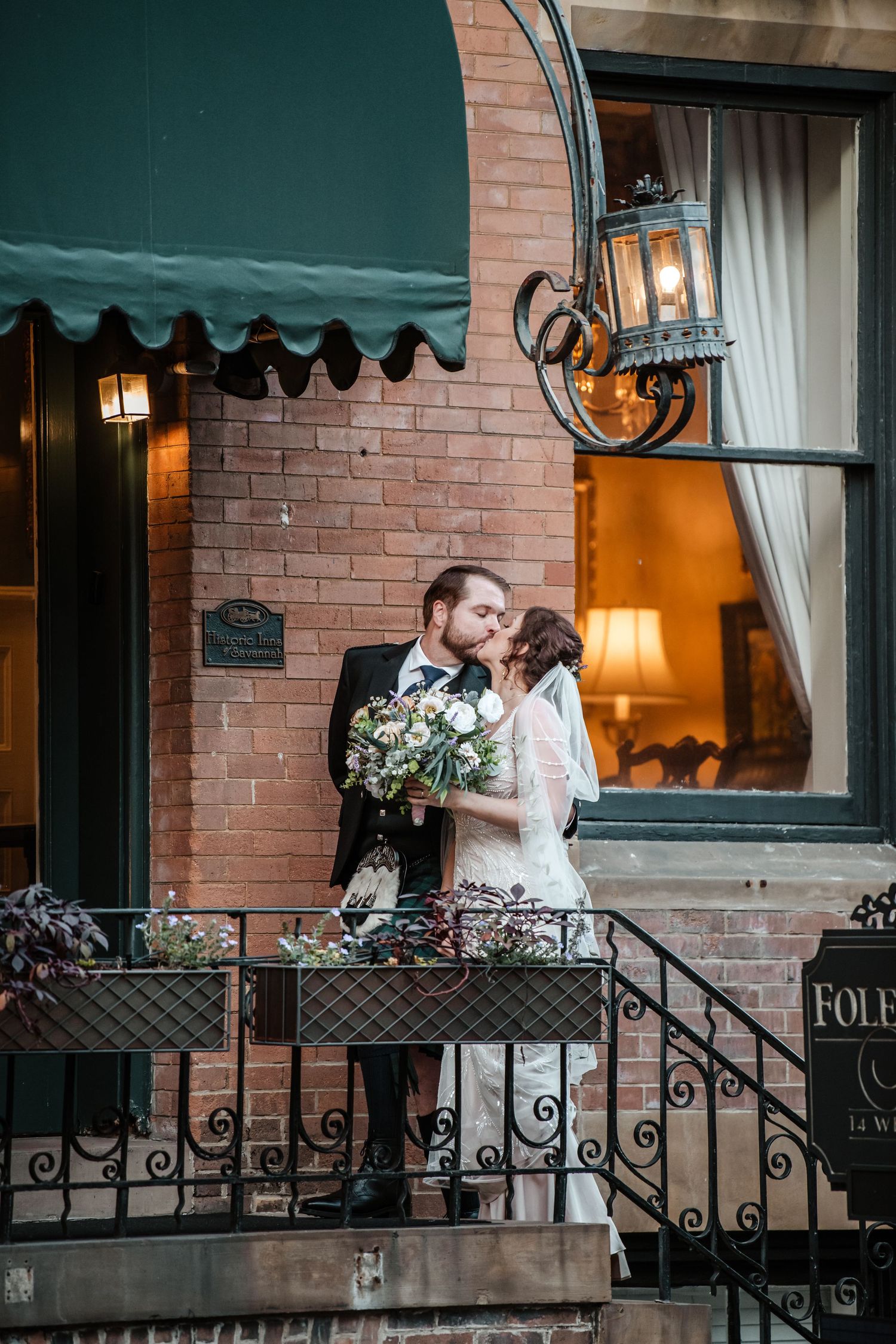 Evening wedding photography at the historic Foley House Inn with warm interior lighting.
