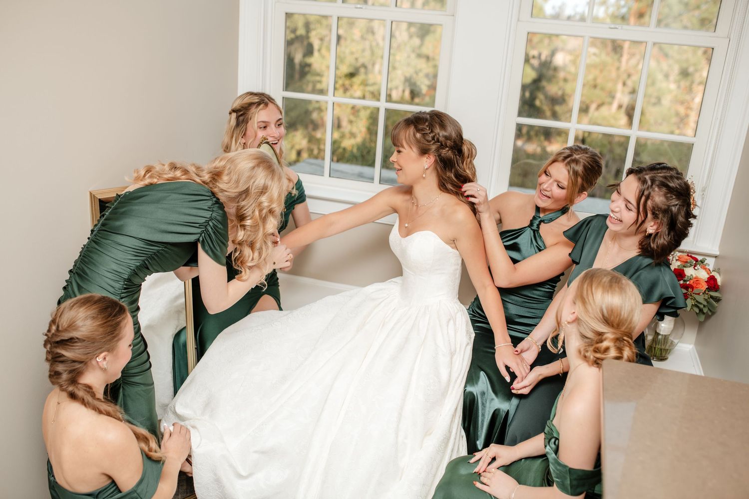Candid shots of a wedding party laughing and having fun during formal photos.