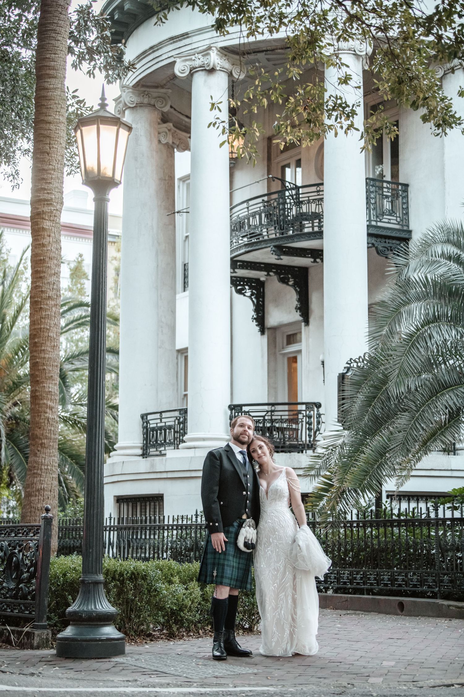 Wedding photography series at a grand southern mansion with white columns and palm trees.