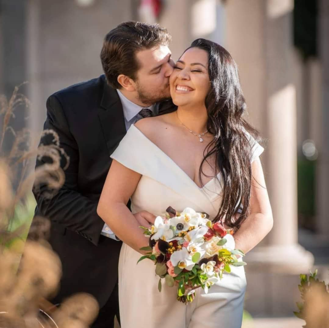 Romantic outdoor wedding portraits with soft natural lighting and floral bouquet details.