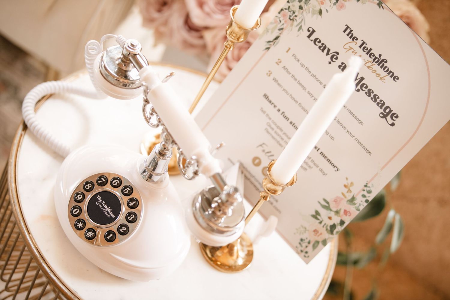Vintage-style wedding accessories and details arranged on table.