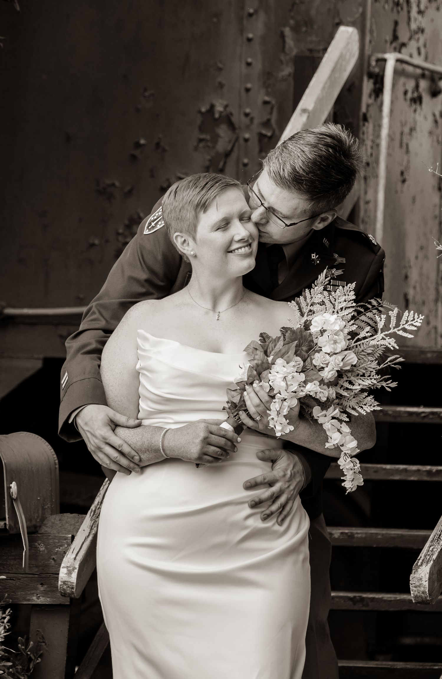 Black and white romantic wedding portraits with floral bouquet.