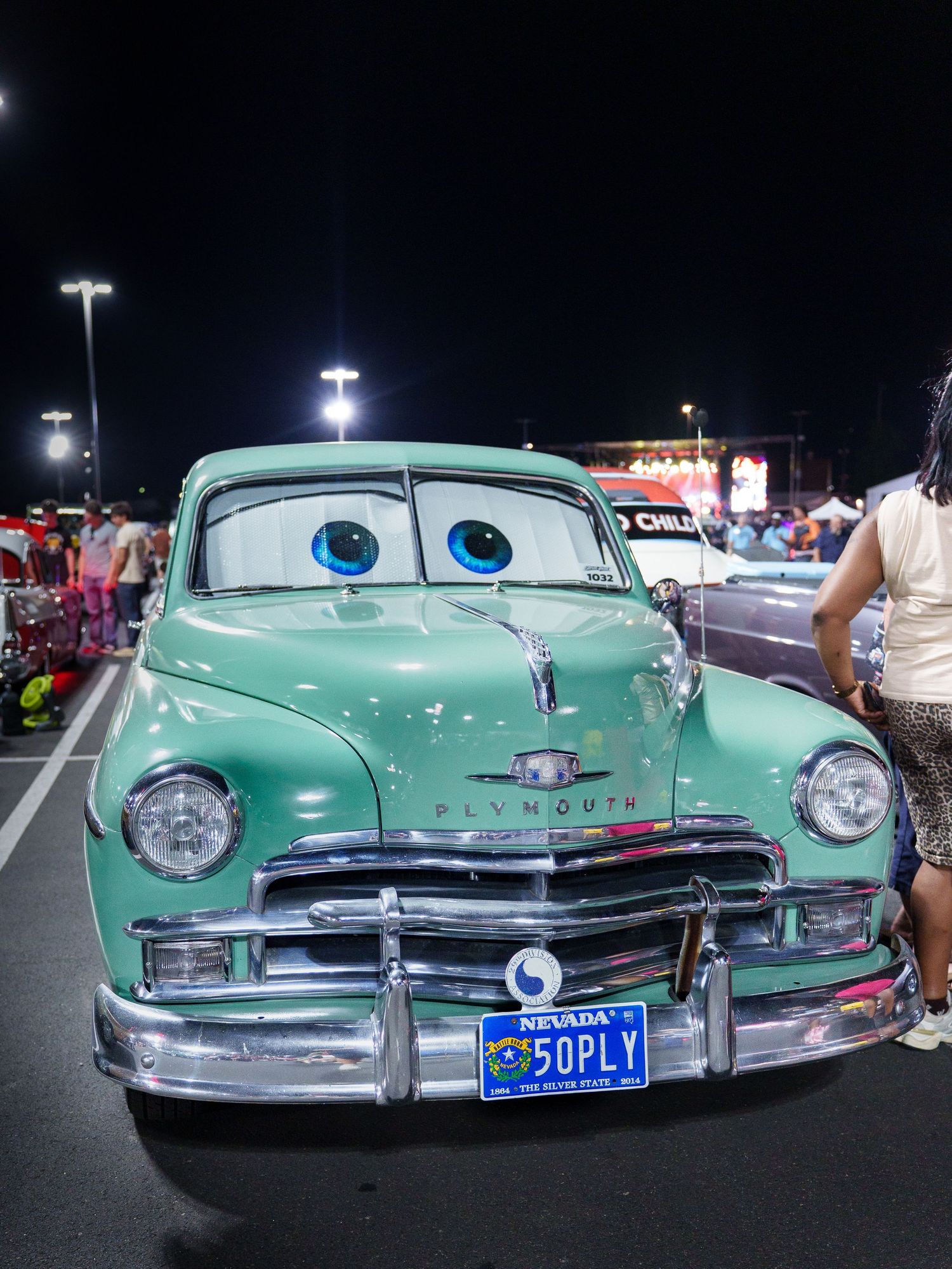Classic Plymouth car decorated with cartoon eyes resembling the movie Cars, Nevada license plate 50PLY.