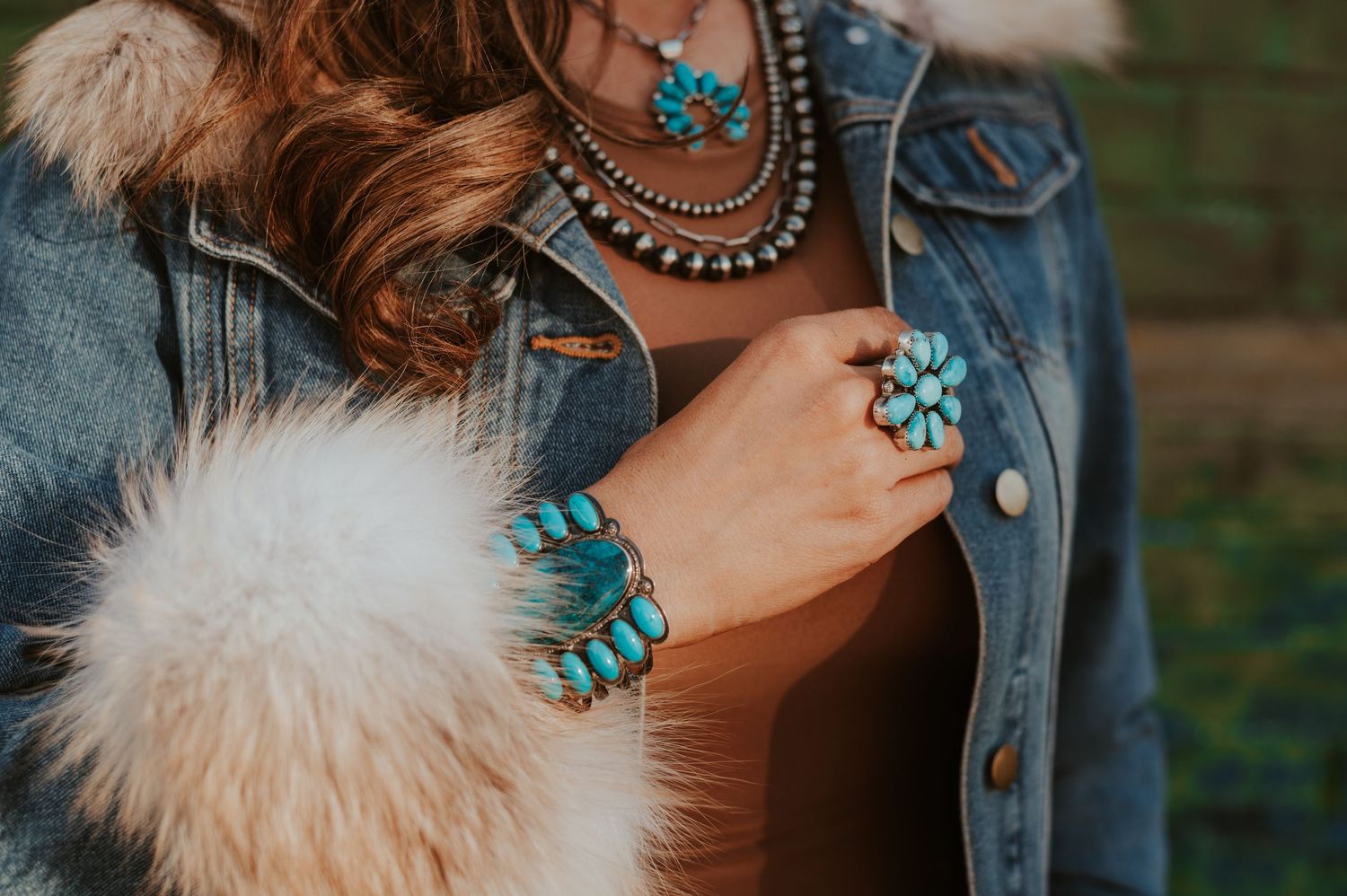 Close-up details of turquoise jewelry and western fashion accessories.