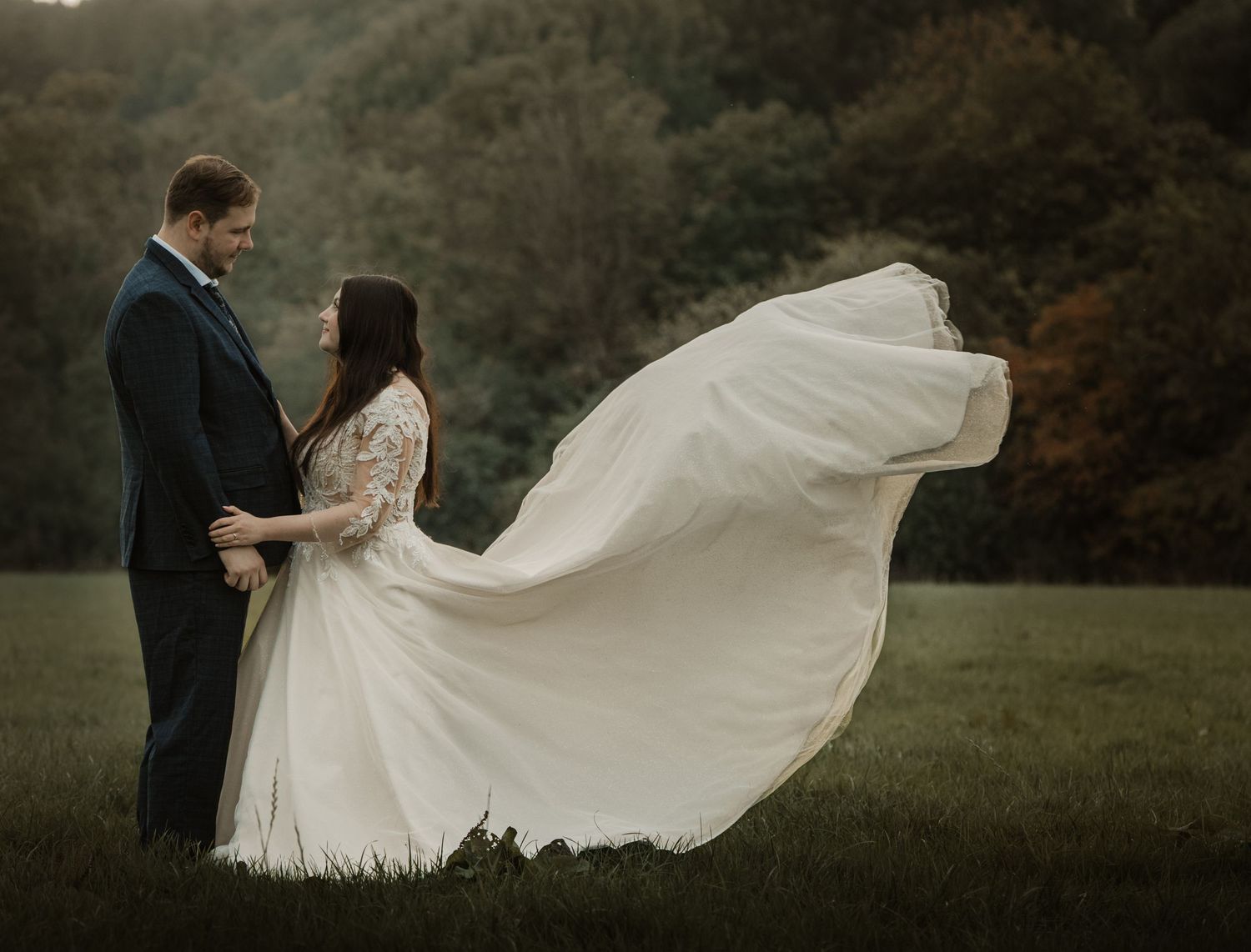 Artistic wedding sequence showing flowing dress movement in an outdoor setting.