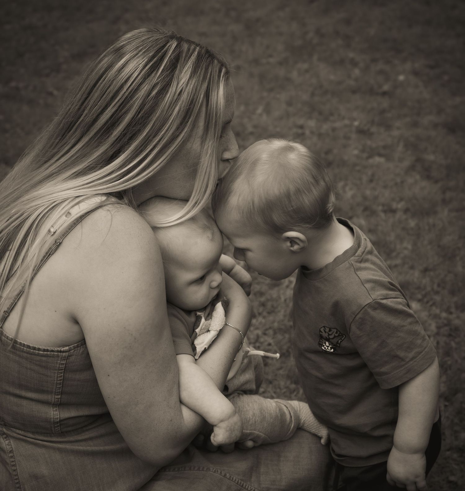 Intimate black and white portrait series showing tender family moments.