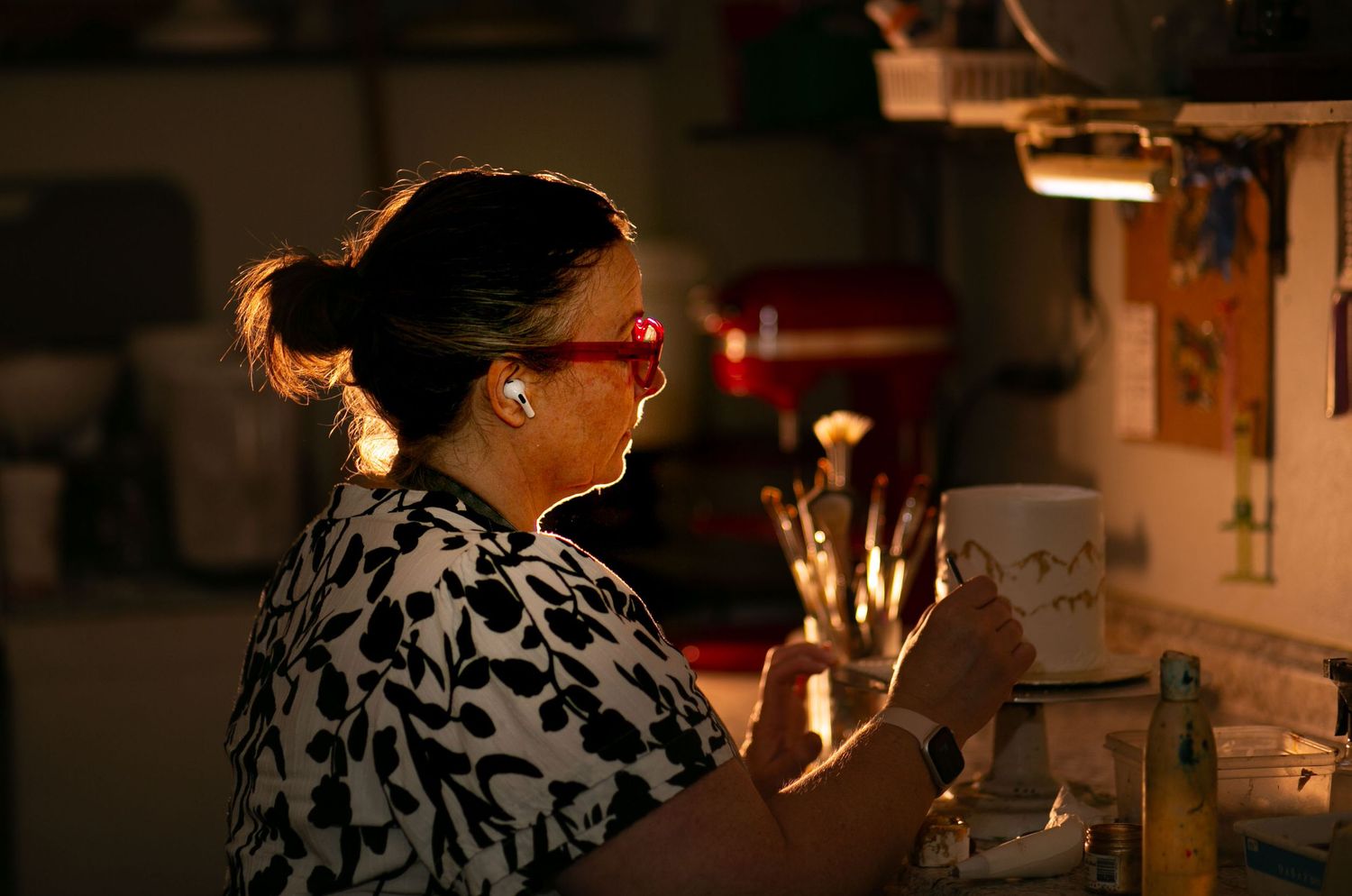 A candlelit dinner scene with warm lighting and intimate ambiance creates a romantic atmosphere at a restaurant table.