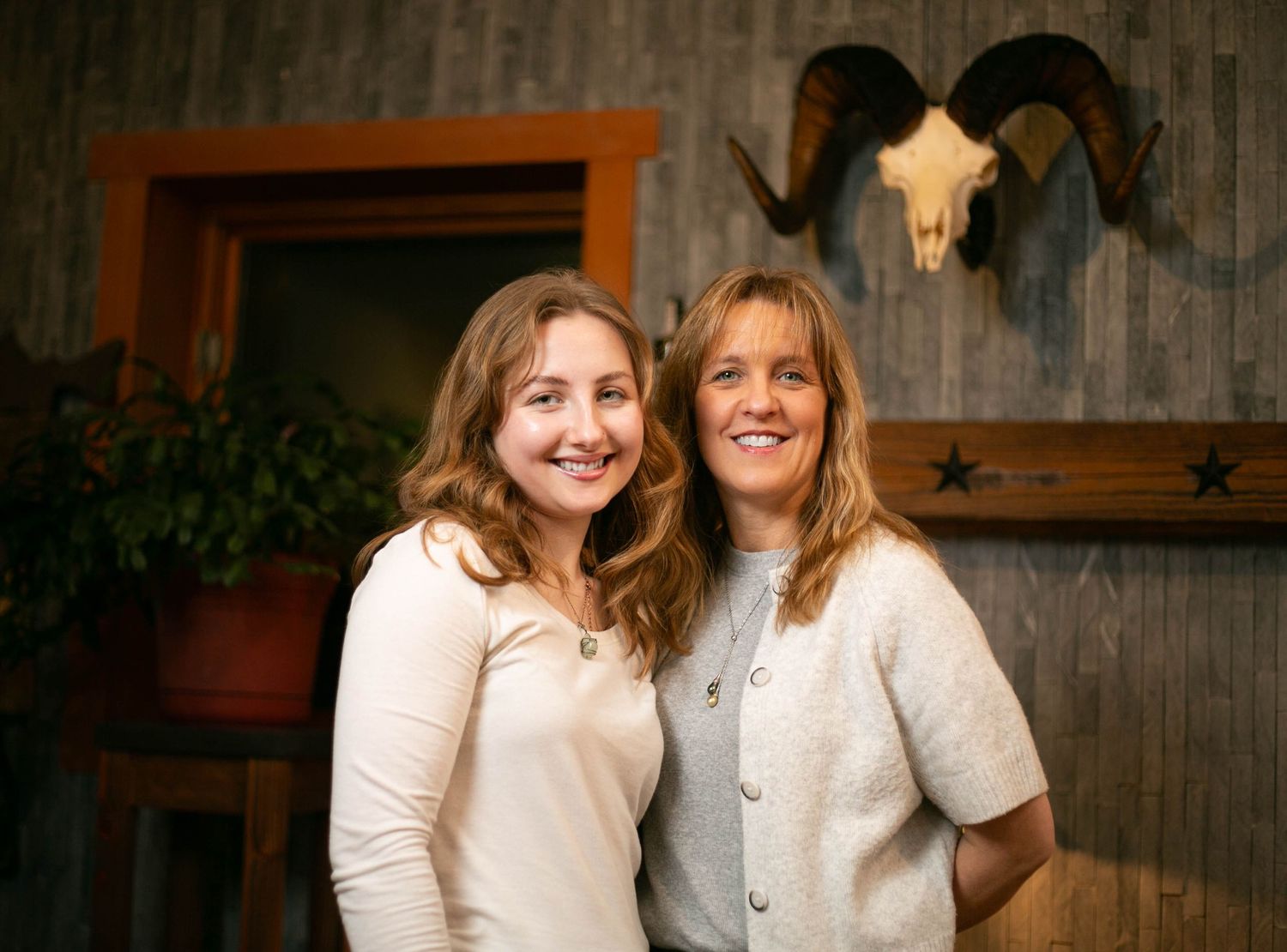 A series of seven photo booth style images showing people in white outfits posing and smiling together.