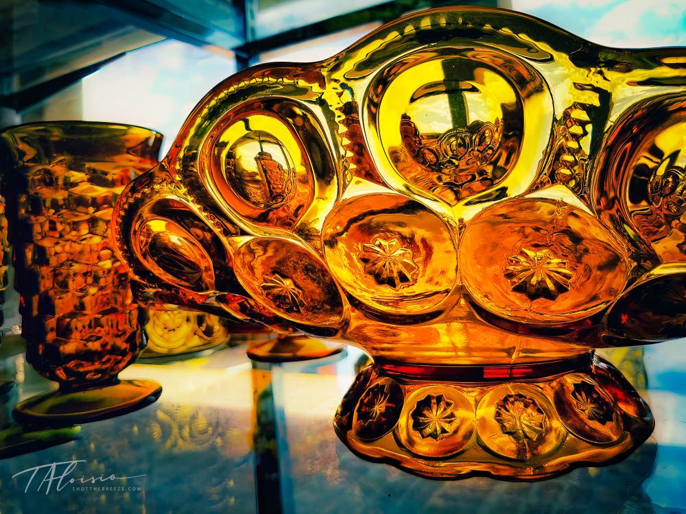 Close-up sequence of golden amber liquid being poured in artistic lighting.