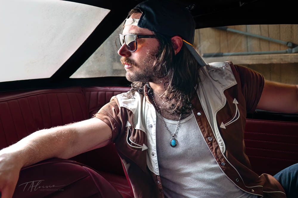 Candid portraits in a car interior with natural lighting and casual atmosphere.