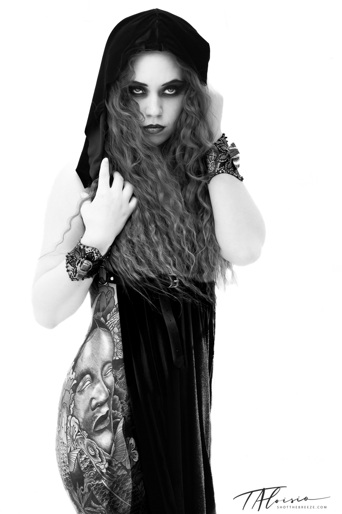 Gothic fashion portrait series featuring flowing dark hair and black clothing against white background.