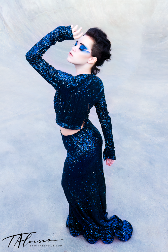 Artistic sequence showing a figure in a sparkly blue dress against a light background.