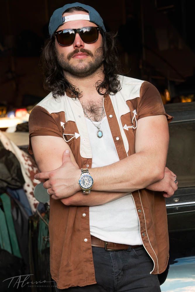 Person wearing sunglasses and brown vest poses confidently in sequence of casual portrait shots.