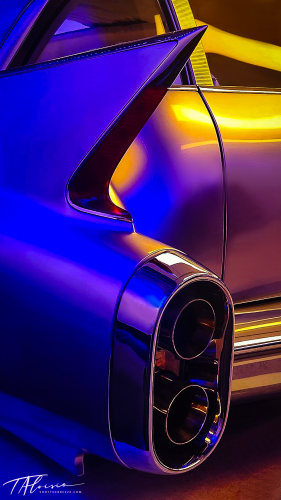 Detail shots of a blue car's taillight design illuminated with dramatic lighting.