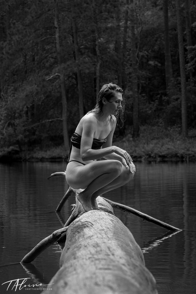 Artistic black and white sequence of a person sitting on a log over a serene lake.