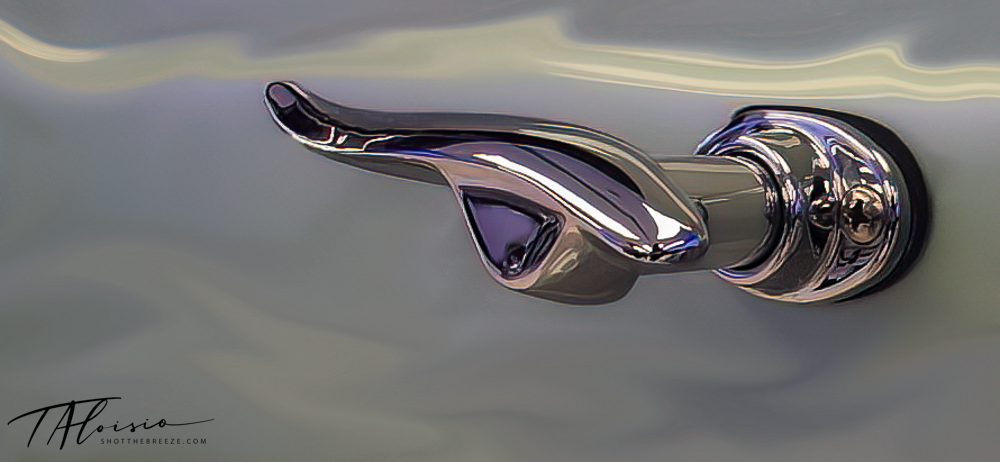 Abstract chrome automotive detail shots with smooth metallic reflections.