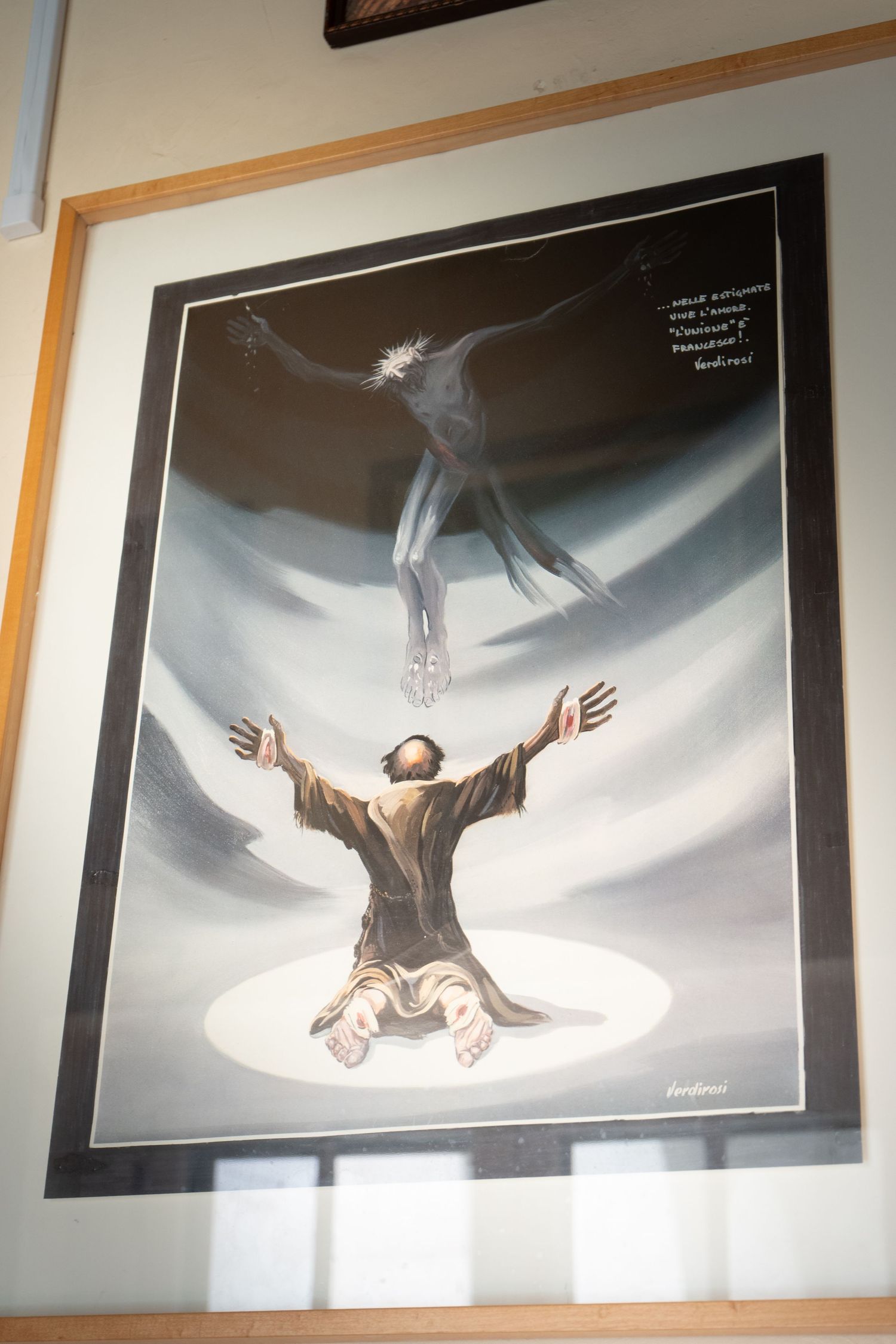Series of framed black and white photographs showing a figure floating against a bright background in artistic poses.