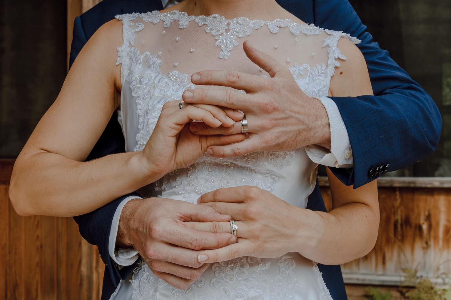 Close-up shots of hands gently holding a small white bunny rabbit.