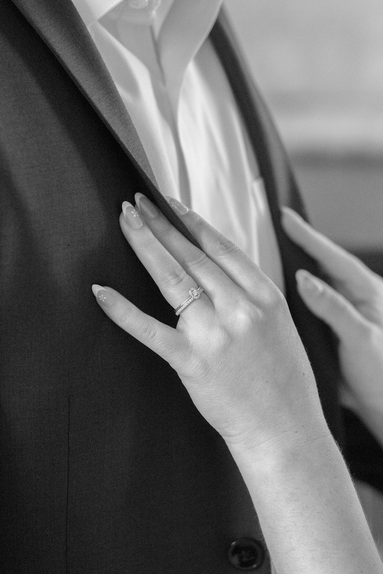 Close-up sequence showing hands with engagement ring against formal attire.