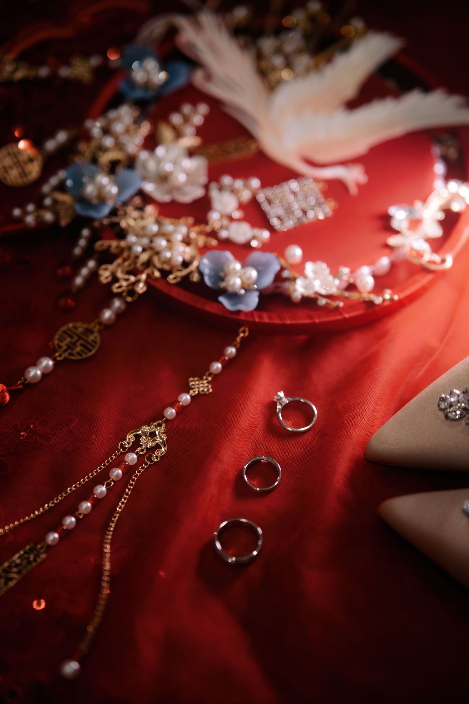 Detailed flat lay of Chinese wedding accessories including rings and gold jewelry for a Penang bridal morning