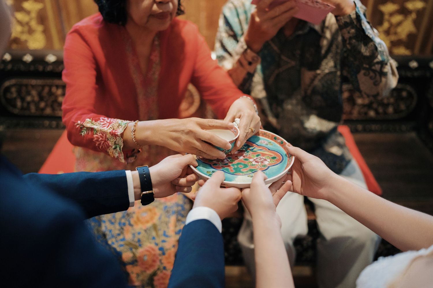 Close-up of a traditional Seven Terraces Penang wedding tea ceremony with couple's parent