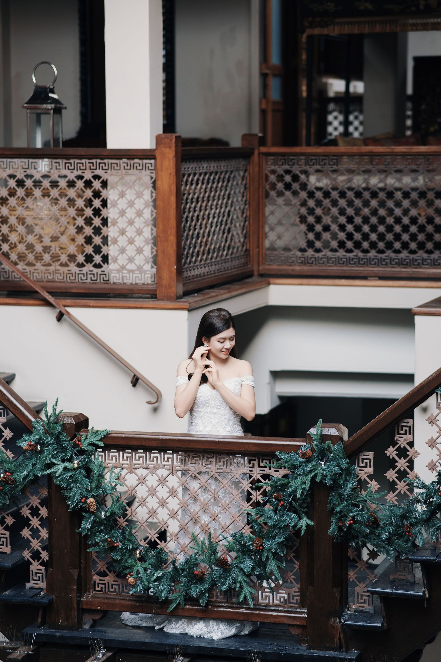 Bride posing for heritage wedding photography Penang on a decorated staircase at Seven Terraces