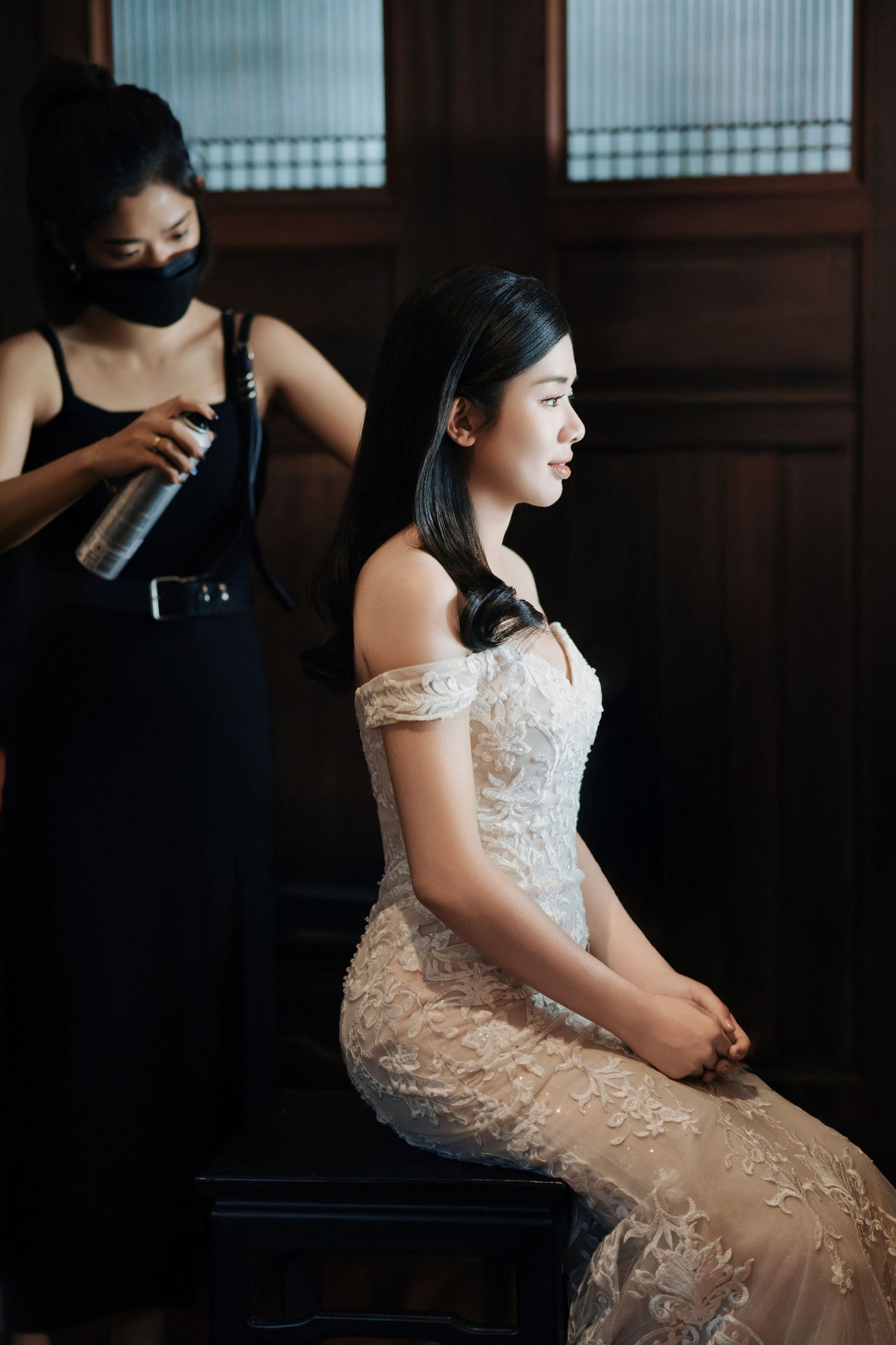 Stylist preparing a bride at Seven Terraces boutique wedding venue Penang, highlighting the hotel's elegant interiors.