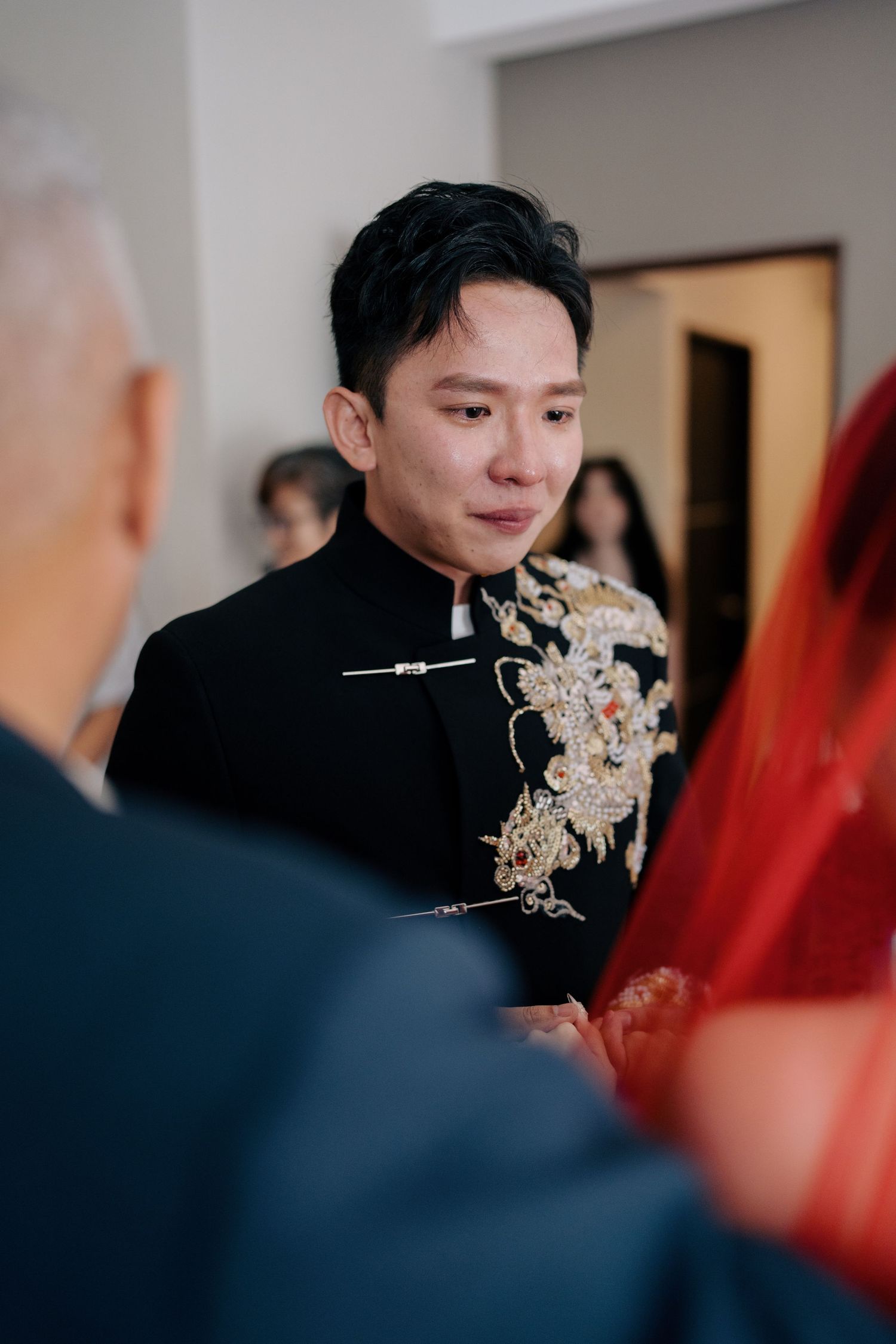 Close-up of a groom with tears in his eyes looking at his bride during a traditional ceremony